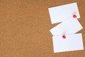 Cork board with three white cards pinned to it Royalty Free Stock Photo