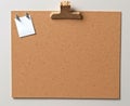 Cork board with white sticky notes or sheets of note paper.