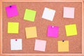 Cork board wood background with post it notes in different radiant colours. Cork board surface. Close up background of cork board. Royalty Free Stock Photo