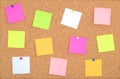 Cork board wood background with post it notes in different radiant colours. Cork board surface. Close up background of cork board. Royalty Free Stock Photo