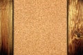 Cork board at wooden panel wall background