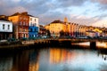 Bank of the river Lee in Cork, Ireland city center with various shops Royalty Free Stock Photo