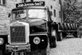 Loading wooden barrels on old open truck trailer in museum Royalty Free Stock Photo