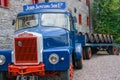 Loading wooden barrels on old open truck trailer in museum Royalty Free Stock Photo