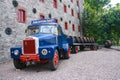 Loading wooden barrels on old open truck trailer in museum Royalty Free Stock Photo