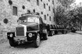 Loading wooden barrels on old open truck trailer in museum Royalty Free Stock Photo