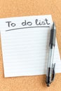 Cork memory board with blank piece of paper and  pen, to do list, bulletin board, vertical Royalty Free Stock Photo