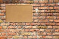 Cork noticeboard with wooden frame on brick wall