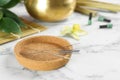 Cork plate with acupuncture needles on white marble table Royalty Free Stock Photo