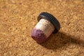 cork stopper and used plastic handle taken from a branded bottle of red wine