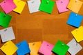 Corkboard/Bulletin Board bordered completely by very disorderly  multicolored stiky type square notes.  The notes are all blank Royalty Free Stock Photo