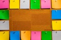 Corkboard/Bulletin Board bordered completely by very orderly placed multicolored stiky type square notes.  The notes are all blank Royalty Free Stock Photo