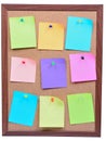 Corkboard with empty colorful notes on white background Royalty Free Stock Photo