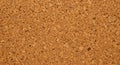 Corkboard surface composed of closely packed, granulated cork pieces in various Royalty Free Stock Photo