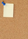 Corkboard with thumb tacked note Royalty Free Stock Photo