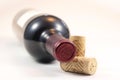 Corks and red wine bottle Royalty Free Stock Photo