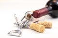 Corks, red wine and corkscrew Royalty Free Stock Photo