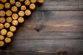 Corks of wine bottles pattern on dark wooden background top view copyspace Royalty Free Stock Photo