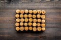 Corks of wine bottles pattern on dark wooden background top view copyspace Royalty Free Stock Photo