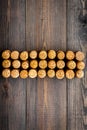 Corks of wine bottles pattern on dark wooden background top view copyspace Royalty Free Stock Photo