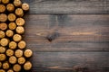 Corks of wine bottles pattern on dark wooden background top view copyspace Royalty Free Stock Photo