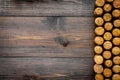 Corks of wine bottles pattern on dark wooden background top view copyspace Royalty Free Stock Photo