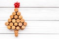 Corks of wine bottles in shape of new year spruce on black background top view Royalty Free Stock Photo