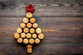 Corks of wine bottles in shape of new year spruce on dark wooden background top view copyspace Royalty Free Stock Photo