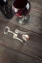 Corkscrew and a glass of wine on an old wooden table Royalty Free Stock Photo