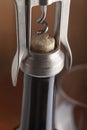 Corkscrew and a glass of wine on an old wooden table Royalty Free Stock Photo