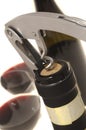 Corkscrew opening wine bottle Royalty Free Stock Photo