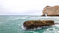 Cormorant on a Rock in Stormy Waters at Etretat Beach, France Royalty Free Stock Photo