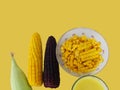 Corn, boiled yellow and purple corn, corn sliced in a cup, milk in glass and fresh corn on the cob Royalty Free Stock Photo