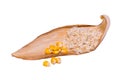 Corn bran with yellow corn kernels on a dry brown corn leaf Royalty Free Stock Photo