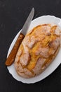 Corn bread with knife on white dish Royalty Free Stock Photo