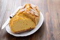 Corn bread with knife on white dish Royalty Free Stock Photo
