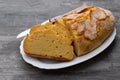 Corn bread with knife on white dish Royalty Free Stock Photo