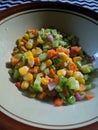 Corn carrot and cucumber salad in a bowl Royalty Free Stock Photo