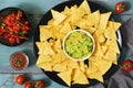 Corn chips nachos on a green blue wooden background. Top view. Mexican food.