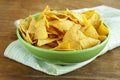 Corn chips (nachos) in a green bowl Royalty Free Stock Photo