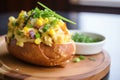 corn chowder in bread bowl with melted cheese Royalty Free Stock Photo