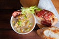 Corn chowder soup with bacon. Brown wooden background. Close-up view Royalty Free Stock Photo