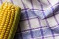 Corn Cob on bowl and rustic fabric. Food of Festa Junina, a typical brazilian party.