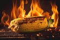 Corn on the cob cooking on a fiery BBQ grill