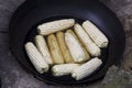 Corn cob is put into the pot of black