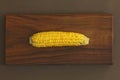 Corn on cob on rustic wooden table and wooden background from a natural wooden. Golden bright yellow corn. Tasty and healthy food Royalty Free Stock Photo