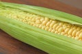 Corn on cob on rustic wooden table and wooden background from a natural wooden. Golden bright yellow corn. Tasty and healthy food Royalty Free Stock Photo