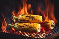 Corn on the cobs cooking on a fiery BBQ grill cob
