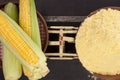 Corn cobs and corn flour on old weight scale. Royalty Free Stock Photo