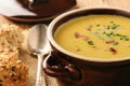 Corn cream soup with bacon chowder on wooden background. Royalty Free Stock Photo